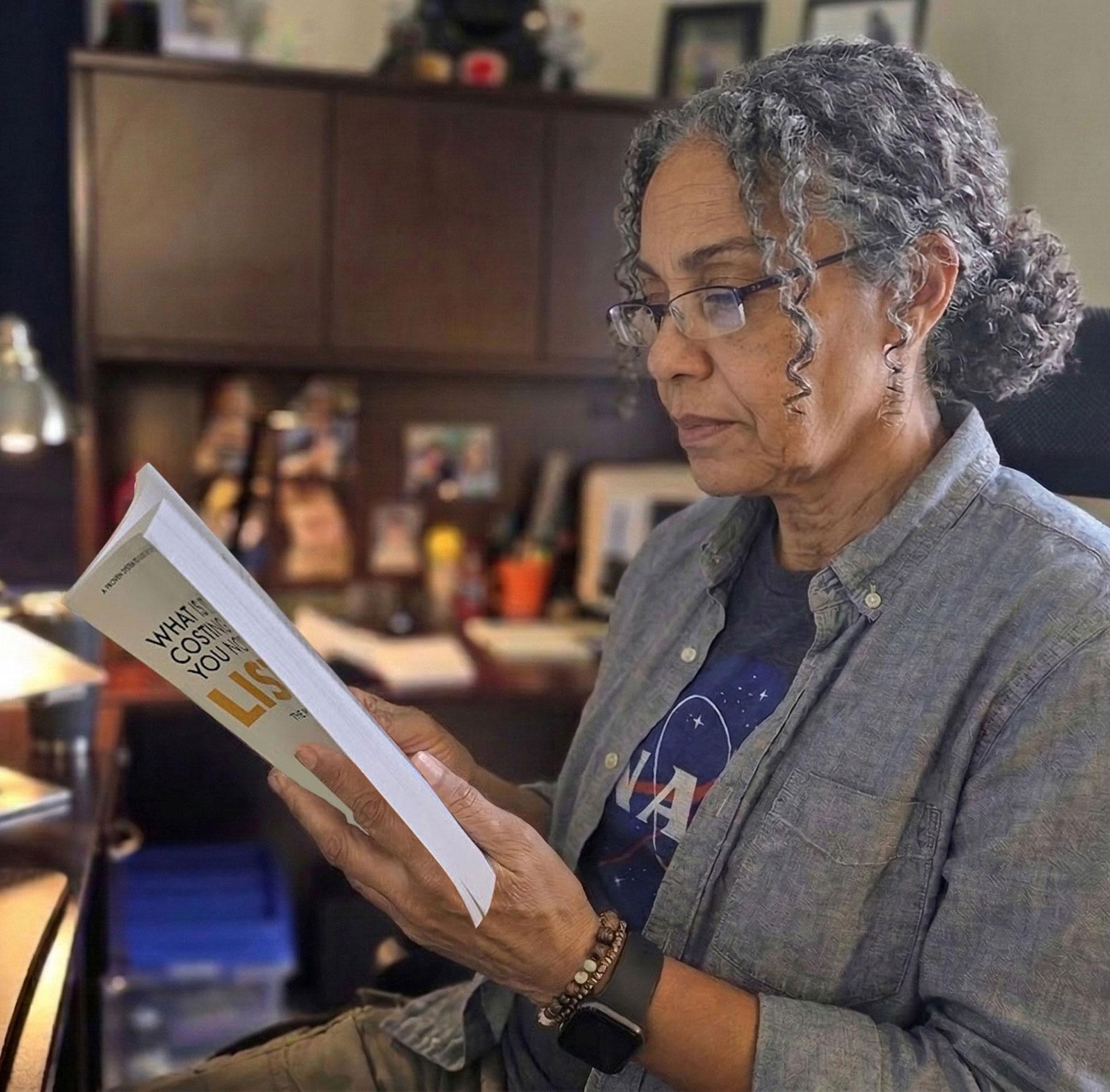 Patient utilizing high-powered near vision glasses